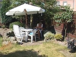 Blonde milf showing off her boobs outdoors