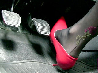 Driving in Scarlet Patent Pumps and Phillipe Matignone Rosed Stockings