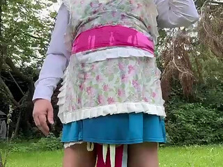In gardener outfit to take a piss shower with bottles