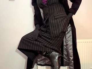 Crossdressing sissy dressed in her new skirt suit and long coat