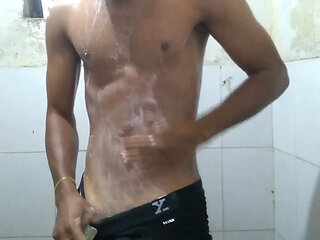 The boy masturbating inside bathroom.