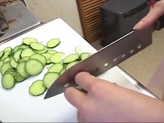 Insatiable Young Wife Drenches Cucumber Deep in Kitchen Sink