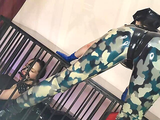 Latex Officer Fucks His Latex Prisoner with a Strap-on