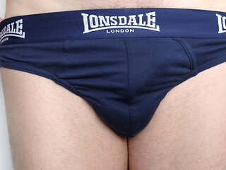 Close up on crotch in navy blue briefs slips out hairy floppy penis, plays with foreskin as he wanks his cock becomes semi erect