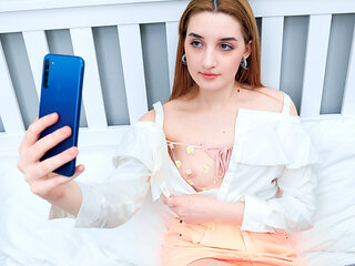 Cute Brunette Jerks Off Her Horny Pussy On The Bed