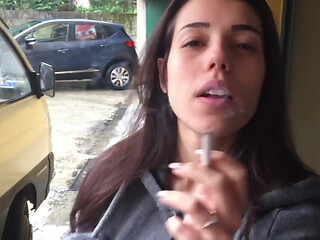 Outdoors smoking from the stunning brunette