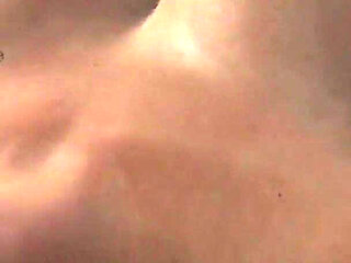 Stepmom on her bed with her dildo