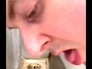 Licking a filthy public urinal