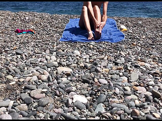 Cute exhibitionist girl get naked in public beach