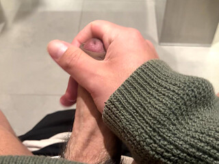 jerking off at the airport's restroom