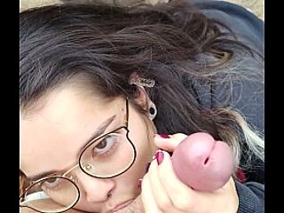 Cute nerd girlfriend gives sloppy POV blowjob in public park
