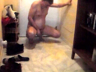 John is pissing on the hallway floor