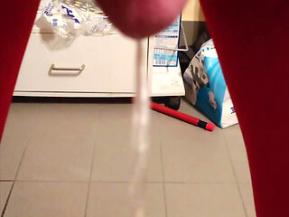 Pissing at Home in Red Legging with Penis Sleeve