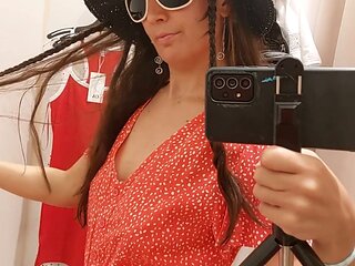 Amateur brunette shows off her thick tits and furry pussy while trying on clothes in the fitting room