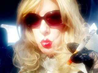 MRS. ROMAN SMOKING MARLBORO 100's IN HER CAR