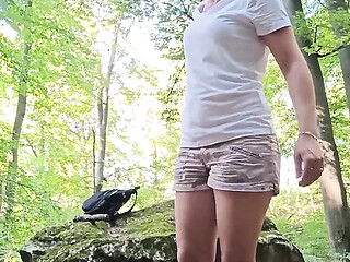 Women's pussy is filled by a stick.