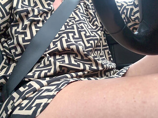 Elegant sexy stepmom drives cheerfully to work in the morning