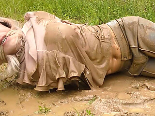 Tied up and left in the mud! Wet and messy tranny girl pees in her pants!