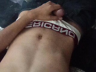 Naked Latino on hot bed wanting to fuck