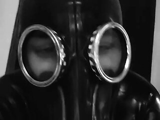 Rubber slave play with big dildo