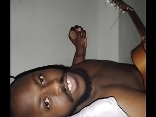 Translating other meanings of horns in the air while singing and playing guitar naked