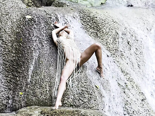 Wet and sexy Russian MILF Monika Fox in a fishnet at the waterfall