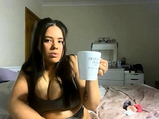 Busty curly brunette with big boobs fucks on couch