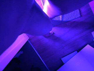 Real couple gets naughty in the bathroom under blue lights.
