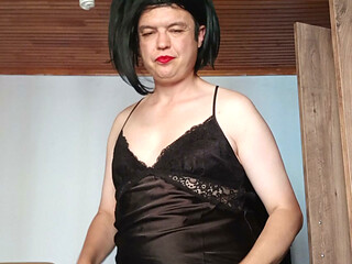 Sexy CD posing on her feet in naughty black lingerie