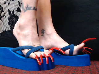 Extreme long long red toenails