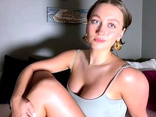 Blonde mature with big boobs masturbates in bed