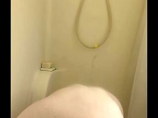 Busty and curvy girl plays with dildo in the shower