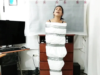 Mummified panty head prepares for bondage session
