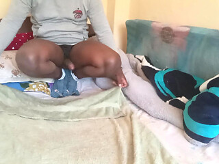 Naughty African guy solo jerking off in bed
