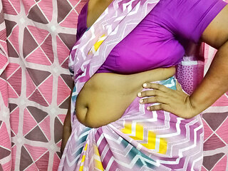 A beautiful Tamil wife, tying a sexy saree, arouses lust and leaves for work.
