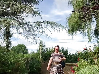 In an outfit with a ruffled anthracite dress for an evening.