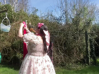 In a babydoll outfit to hang out the laundry outside