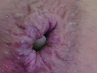 Close-up of a bottle inserted into the anus...