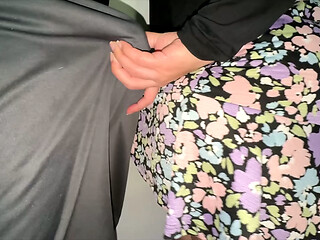 She grabs the penis of a stranger with a huge erection.