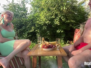 On a warm, summer day, a mature couple enjoys sex outside their house