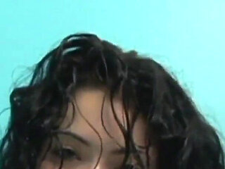 Tattooed brunette Andrea Kelly fucks her horny hairy pussy alone