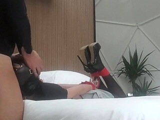 Bound, blindfolded, and gagged milf in high heels