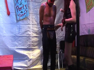 Dominant brunette MILF controls her masked bound slave