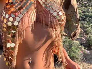 The Golden Princess pleasures herself outdoors.