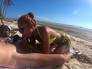 Asian babe gives sensational blowjobs on a sunny beach in sunglasses