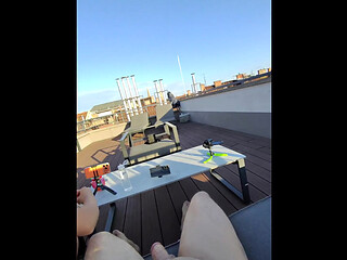 Super sexy and hot real redhead masturbates on open terrace under the sun spreads legs and gives an oily handjob