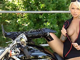 This Beautiful Biker Shows You the Curves of Her Body and Those of Her Motorbike