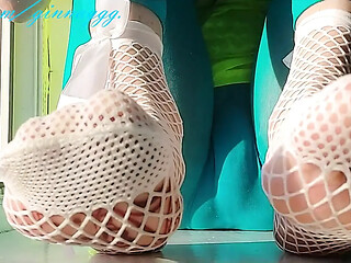 Hot Japanese babe gives a sensual foot massage with slippery toes.