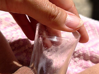 Inserting a Small Cup Into the Wet Pussy