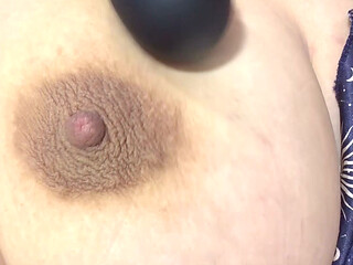 Mother masturbates with a vibrator her delicious tits